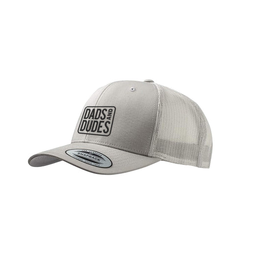 Dads And Dudes Green Embroidered Logo Trucker Cap on white background.