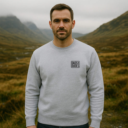 Front view of man wearing a Grey Dads And Dudes Sweatshirt while hiking.